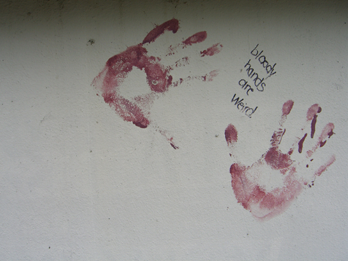 Flagler College bloody hands grafitti picture