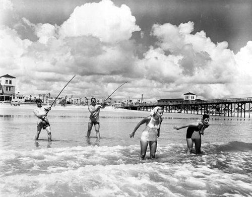 Photo of historic couples fishing at pier