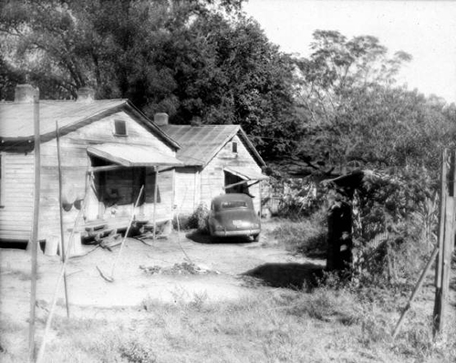 Historic Two Residences and Community Outhouse Picture