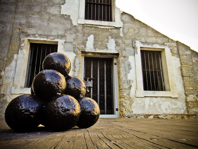 Photo of stacked cannonballs and windows in Saint Augustine Florida