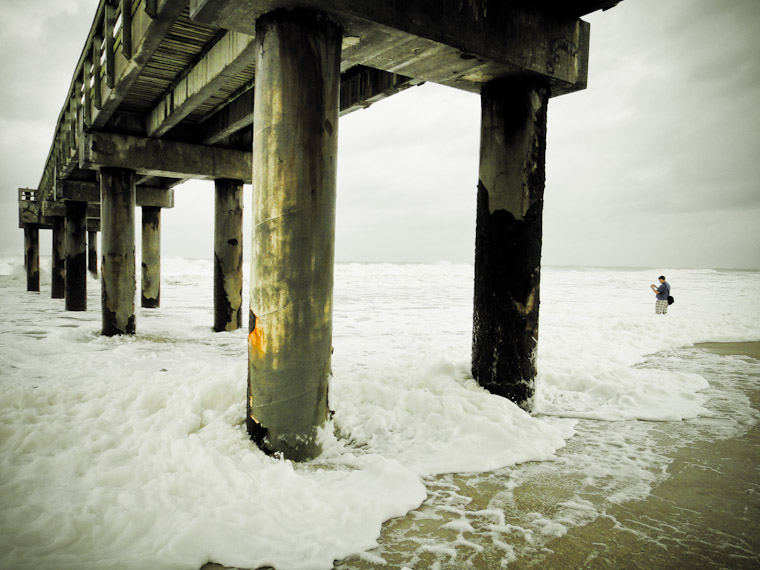 Knee deep in sea foam at St Augustine Beach Florida