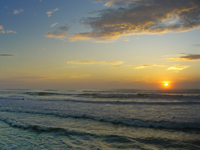 Daybreak paddle-out surfer