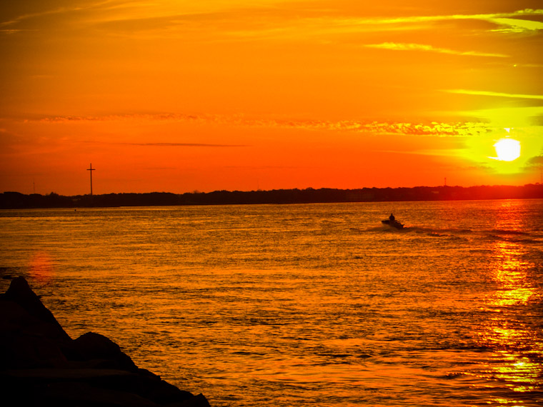 Boat returning at sunset