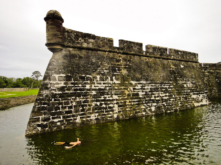 Person doing back float in Castillo de san marcos moat