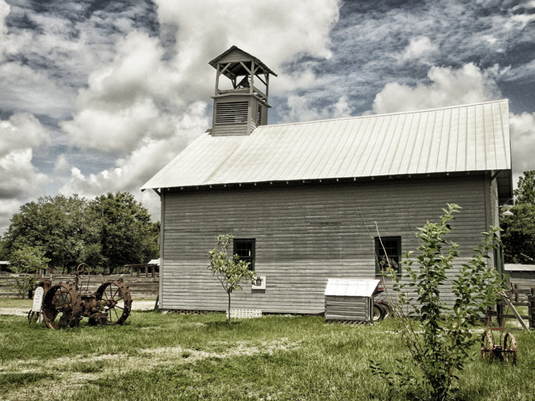 Agricultural museum barn and rusted tractor