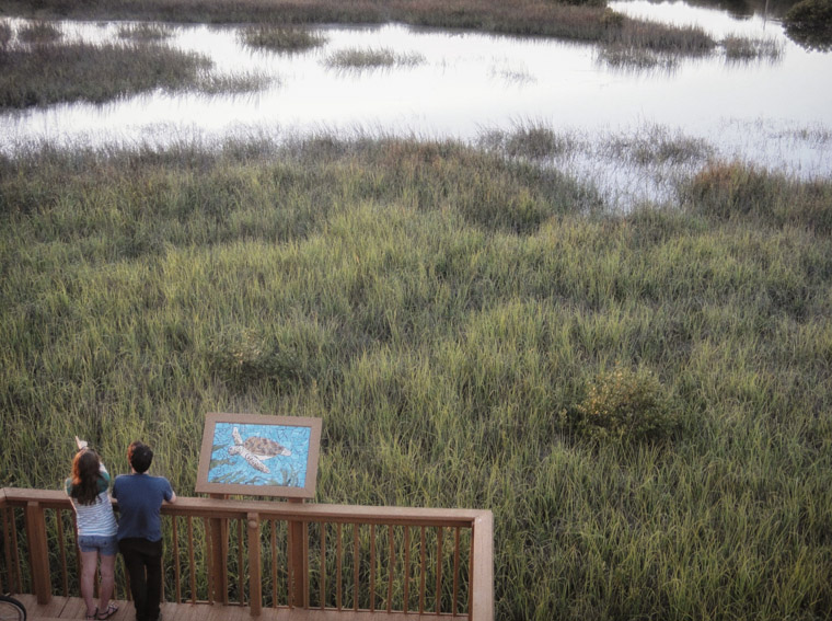 Vilano bridge of boardwalk on marsh with kids