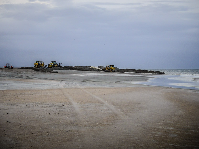 Beach dredge by pier