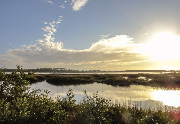 Intracoastal sunrise sailboats marsh