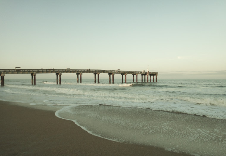 Beach pier sunset waves