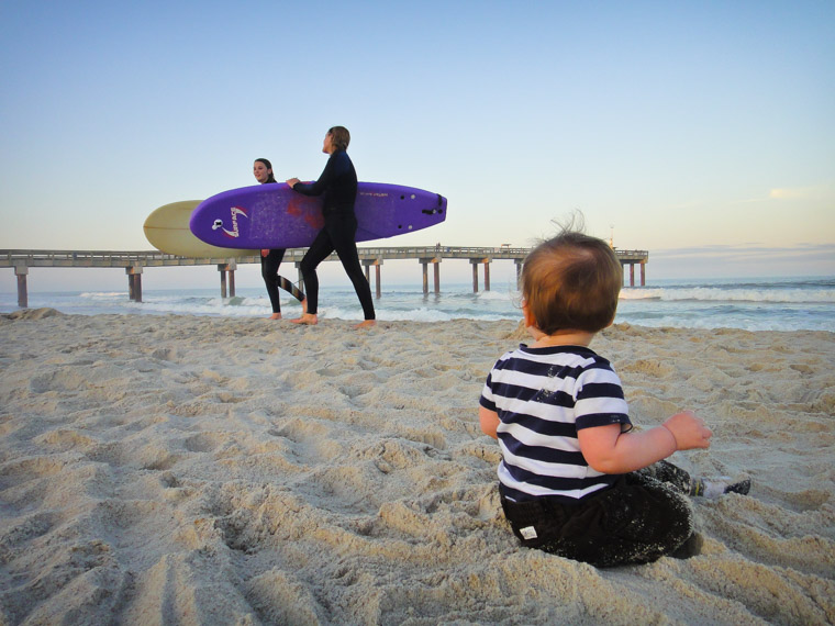 Pier beach surfers sunset