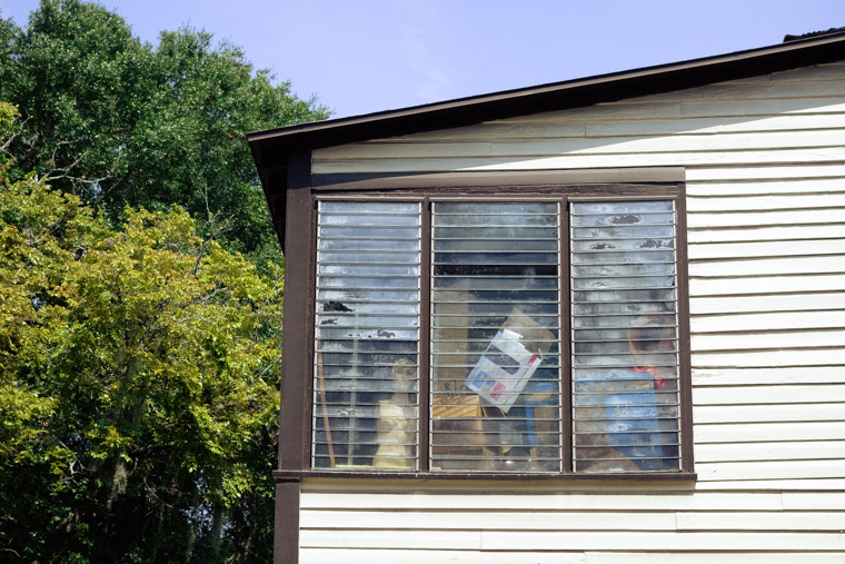 Mannequin in house window