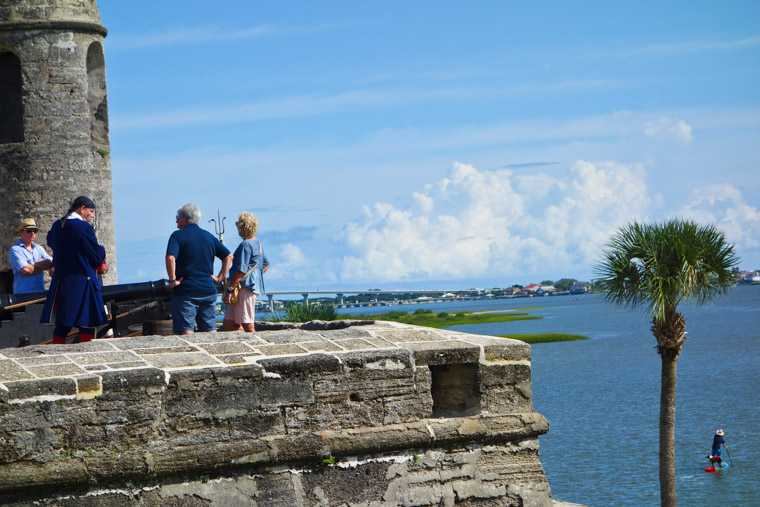 Stand up paddleboarding by fort castillo de san marcos cannon