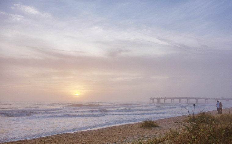 Beach Pier couple sunrise sky