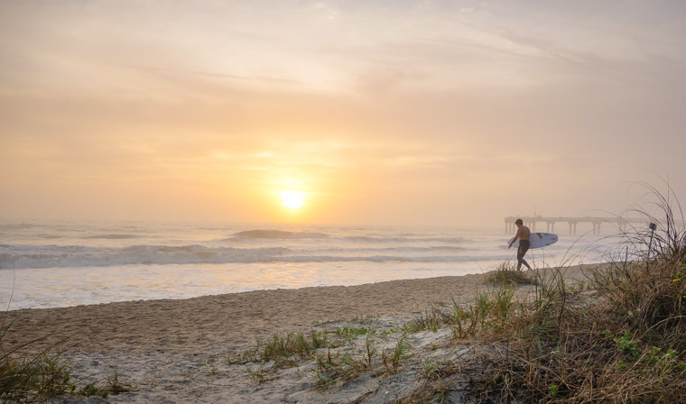 Sunrise surf session at pier